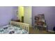 Bright bedroom with a twin bed, built-in shelving, and a light-colored floor at 4850 St James Ct, Winter Haven, FL 33881