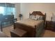 Well-lit bedroom with a double bed, a chest of drawers, and a decorative headboard at 4850 St James Ct, Winter Haven, FL 33881