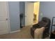 Cozy bedroom with a comfortable chair and access to another room at 4850 St James Ct, Winter Haven, FL 33881