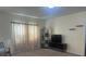 Spacious living room featuring a large TV, comfortable seating and plenty of natural light at 4850 St James Ct, Winter Haven, FL 33881