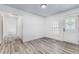 Clean entryway with wood-look floors, a window, and an exterior door at 932 Oak Ln, Lakeland, FL 33811