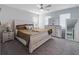 Main bedroom with a king-size bed, dresser, and ceiling fan at 339 Lake Smart Cir, Winter Haven, FL 33881