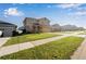 Two-story house with attached garage and landscaping at 339 Lake Smart Cir, Winter Haven, FL 33881