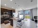 Modern kitchen with granite island, stainless steel appliances, and backyard access at 339 Lake Smart Cir, Winter Haven, FL 33881