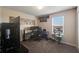 Bright bedroom with large TV, gaming setup, and cat tree at 339 Lake Smart Cir, Winter Haven, FL 33881