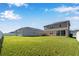 Large backyard with grassy area and two houses at 339 Lake Smart Cir, Winter Haven, FL 33881