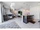 Open floor plan with kitchen island, living room, and staircase at 339 Lake Smart Cir, Winter Haven, FL 33881