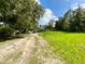 Single-story mobile home with a large covered porch, situated on a grassy lot at 2010 Ridge Meadow Dr, Lakeland, FL 33809