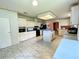 View of kitchen with island, stainless steel appliances, and white cabinets at 2010 Ridge Meadow Dr, Lakeland, FL 33809