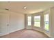 Bright bedroom with bay window and carpet at 1222 Tagliamento Ln, Haines City, FL 33844