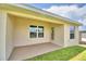 Covered patio adjacent to the house at 506 Tanaro Ln, Haines City, FL 33844
