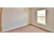 Simple bedroom with a window and neutral carpeting at 506 Tanaro Ln, Haines City, FL 33844