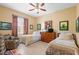 Twin bedroom with two beds, dresser, and adjacent seating area at 4496 Strathmore Dr, Lake Wales, FL 33859