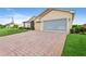 Brick paver driveway and garage with screen at 4496 Strathmore Dr, Lake Wales, FL 33859