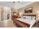 Bright bedroom with king-size bed and en-suite bathroom access at 4496 Strathmore Dr, Lake Wales, FL 33859