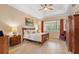 Spacious bedroom with king-size bed, ceiling fan, and ample closet space at 4496 Strathmore Dr, Lake Wales, FL 33859