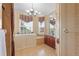 Walk-in shower, large soaking tub, double vanity, and updated fixtures at 4496 Strathmore Dr, Lake Wales, FL 33859