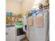 Laundry room with washer, dryer, shelving and additional storage at 4496 Strathmore Dr, Lake Wales, FL 33859