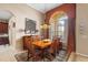 Dining room with a wooden table and an arched window at 4496 Strathmore Dr, Lake Wales, FL 33859