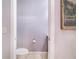 Small half bathroom with toilet and vanity at 8044 Lake Hatchineha Rd, Haines City, FL 33844