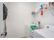 Functional laundry room with washer, dryer, and shelving at 4850 St James Ct, Winter Haven, FL 33881