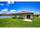 Private backyard with grassy area and patio at 4850 St James Ct, Winter Haven, FL 33881