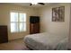 Bedroom with a queen bed, dresser, and window with shutters at 3546 Black Jack Ct, Lake Wales, FL 33898