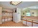 Efficient kitchen featuring wood cabinets and tiled floor at 9650 W Lake Marion Rd, Haines City, FL 33844