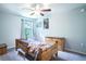 Cozy bedroom with a wooden bed frame and dresser at 997 Pearly Ridge Ln, Lakeland, FL 33809