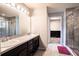 Double vanity bathroom with a walk-in shower at 997 Pearly Ridge Ln, Lakeland, FL 33809