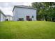 Spacious backyard with a grassy area, providing ample outdoor space at 997 Pearly Ridge Ln, Lakeland, FL 33809