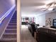 Purple carpeted staircase with LED lighting and a view of the living room at 997 Pearly Ridge Ln, Lakeland, FL 33809