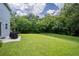 Backyard with grassy area and grill at 997 Pearly Ridge Ln, Lakeland, FL 33809