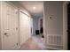 Hallway with carpet flooring, neutral walls, and access to bedrooms and closets at 997 Pearly Ridge Ln, Lakeland, FL 33809