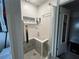 Modern shower with patterned tile and built-in seat at 6750 Winterset Gardens Rd, Winter Haven, FL 33884