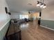 Open living area with hardwood floors and ample natural light at 6750 Winterset Gardens Rd, Winter Haven, FL 33884