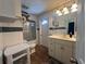 Updated bathroom with walk-in shower and modern vanity at 6750 Winterset Gardens Rd, Winter Haven, FL 33884