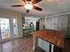 Eat-in kitchen with butcher block island and access to backyard at 6750 Winterset Gardens Rd, Winter Haven, FL 33884