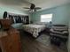 Bright bedroom featuring a large closet and a comfy armchair at 6750 Winterset Gardens Rd, Winter Haven, FL 33884