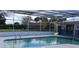 Relaxing pool area with screened enclosure and patio at 6750 Winterset Gardens Rd, Winter Haven, FL 33884