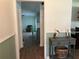 View of entryway, showing wood floors and glimpse into living room at 6750 Winterset Gardens Rd, Winter Haven, FL 33884