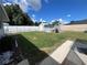 Large backyard with shed and grassy area at 6750 Winterset Gardens Rd, Winter Haven, FL 33884