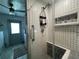 Updated shower with patterned tile and built-in seat at 6750 Winterset Gardens Rd, Winter Haven, FL 33884