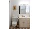 Simple bathroom with updated vanity and tiled floor at 15 Winterset Dr, Winter Haven, FL 33884