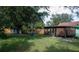 Spacious backyard with a screened-in patio and lush lawn at 15 Winterset Dr, Winter Haven, FL 33884
