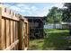 Partially covered backyard patio with additional shed at 15 Winterset Dr, Winter Haven, FL 33884