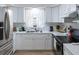 Modern kitchen with white cabinets and stainless steel appliances at 15 Winterset Dr, Winter Haven, FL 33884