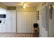 Kitchen with white cabinets and laundry closet at 15 Winterset Dr, Winter Haven, FL 33884