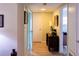 A hallway with light walls and wood-look flooring at 15 Winterset Dr, Winter Haven, FL 33884