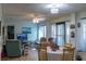 Spacious living room with dining area and access to outdoor space at 15 Winterset Dr, Winter Haven, FL 33884